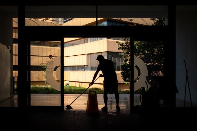 A person cleaning a room